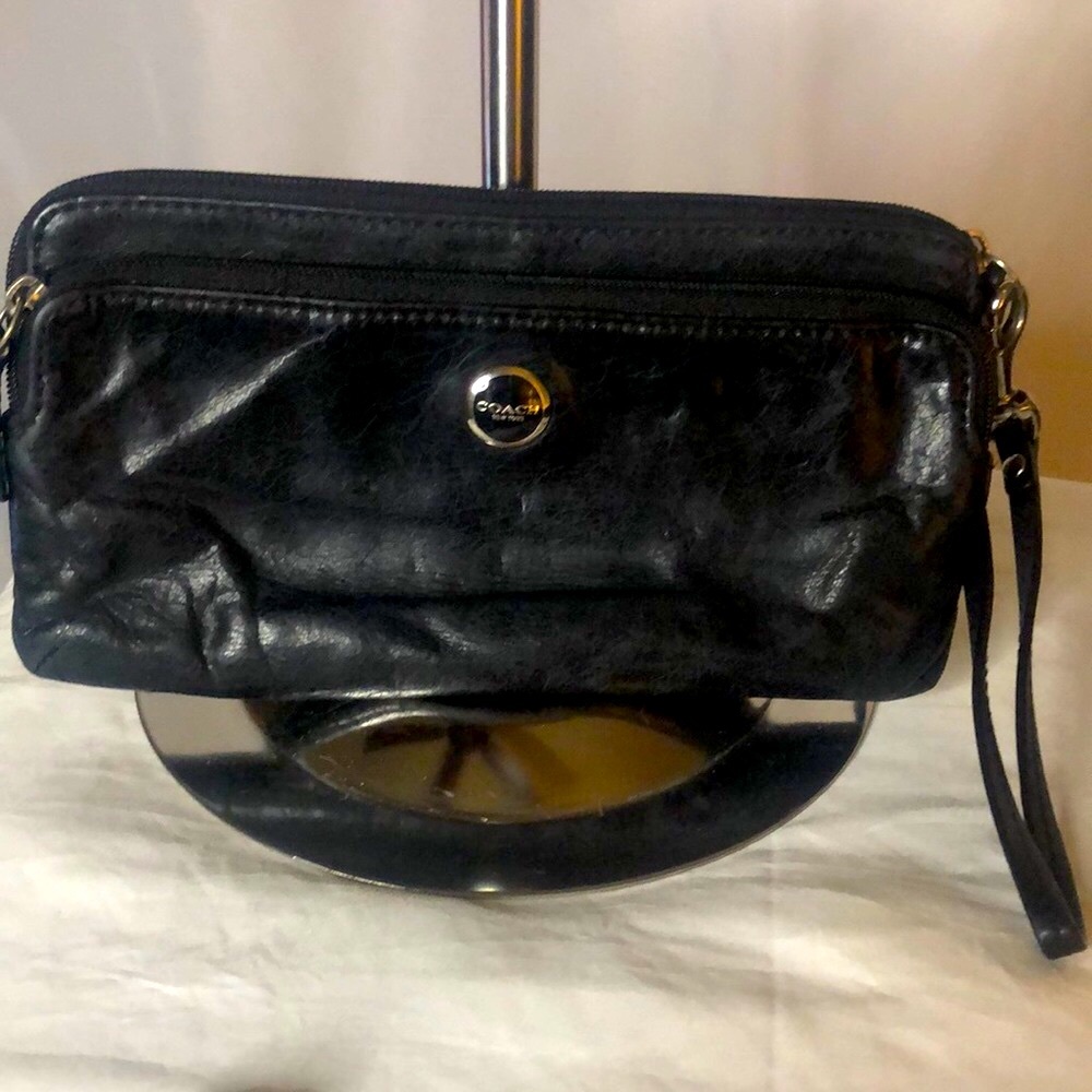 COACH black leather double zip wallet.